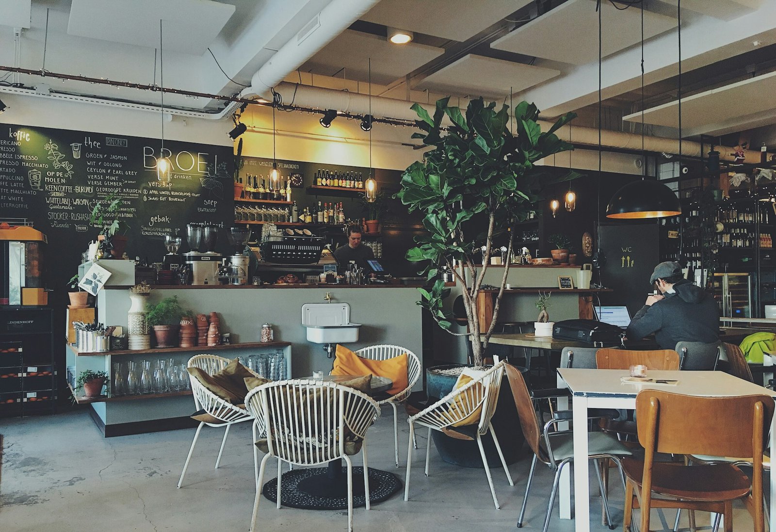 Bright café interior with counter and seating — commercial hospitality space