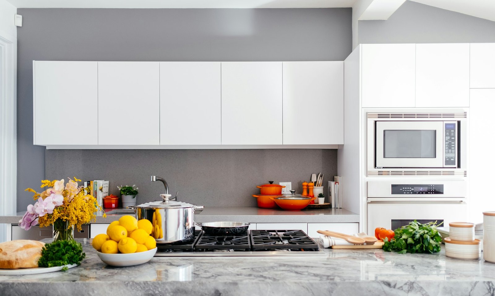Modern kitchen with marble surfaces and natural light — residential home